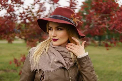 Portrait of beautiful young elegant blonde in hat with feather, scarf and jacket, looking contemptuously somewhere in distance in the autumn park xkwx autumn, hat, fashion, red, people, person, girl, background, beautiful, cute, pretty, forest, face, human, lifestyle, season, hair, outdoor, scarf, young, female, burgundy, portrait, lady, nature, beauty, color, attractive, happy, adult, caucasian, healthy, yellow, smile, leaf, happiness, life, cheerful, women, park, outside, foliage, fall, cap, coat, october, emotional, wool, street, positive