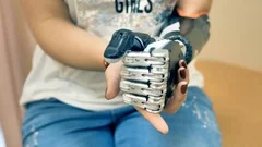 Female using futuristic robotic cyborg arm. Real modern medical robotic