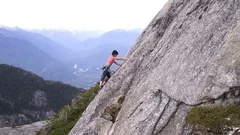 Aerial drone female climbing rocky wall Squamish Canada