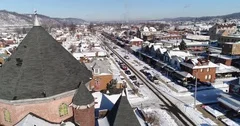 Day Rising Aerial Establishing Shot Small Rust Belt Town in Winter