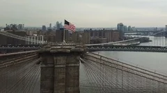 aerial over Brooklyn Bridge circling toward Manhattan skyline 1080 HD