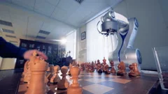 Artificial intelligence, robot chessplayer playing chess with a man. 4K.