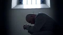Prisoner In Cell Silhouette, Behind Locked Bars In Modern Prison, 4K Inmate