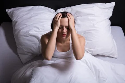 Young Woman Sitting On Bed Suffering From Headache xkwx bed, sleep, insomnia, awake, head, woman, female, sleepless, disturbed, bedroom, suffering, suffer, pain, night, sit, home, sick, stress, unhappy, headache, people, upset, white, sofa, problem, tired, dark, person, blanket, depressed, fever, young, pillow, ill, serious, sitting, painful, closed, casual, depression, eyes, unhealthy, cushion, tanktop, sickness, expression, unwell, closeup, adult