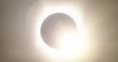 Close Up of Total Solar Eclipse With Cloudy Sky