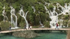 Plitvice Lakes National Park, Croatia: tourists walking by waterfalls