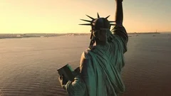 Statue of Liberty beautiful sunset - aerial circling close shot Manhattan NYC