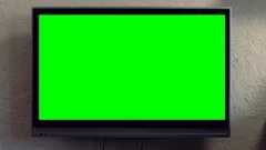 Flat screen TV with green screen composited. TV or television - green screen -