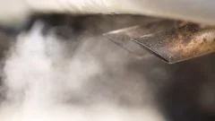 Exhaust pipe releasing a lot of smoke, old car, burning oil, slow motion