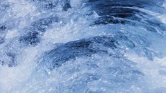 Detail of wake in the sea with water being tossed about in slow motion