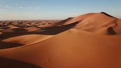 Aerial view on big sand dunes in desert at sunrise