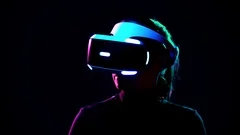 Young woman in VR headset looks around and wonders how amazing. Virtual reality