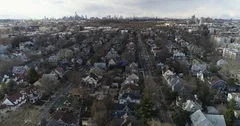 Aerial of NYC Skyline and Residential Area in Queens, New York Fall brown