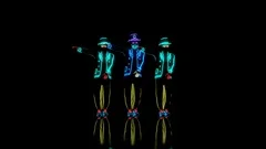 Dance group in neon glowing costumes performs modern house dance