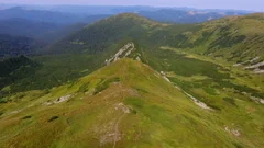 Aerial shot of the horizonless highlands of the Carpathian Mountains n summer