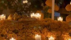 Typical grave with fruit offerings and candles during day of the dead