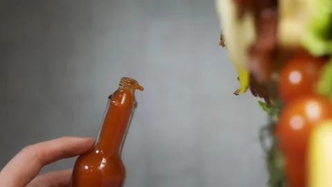 09 drops of chilli sauce in slow motion Stock Footage 221127134