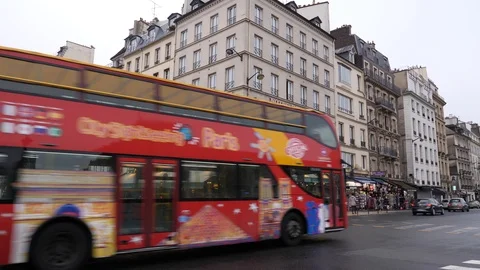 09 Rainy gray winter day Paris street traffic and tour bus goes by Stock Footage 100814604