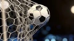 Soccer ball flies into the net on a stadium with yellow and blue lights