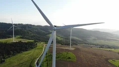 aerial view of clean and renewable wind power farm in motion konverting kinetic