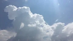 White clouds disappear in the hot sun on blue sky. Time-lapse motion cloud blue 