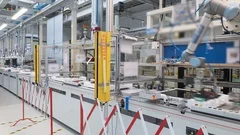 4K time-lapse of a modern industrial line production, robots and humans at work