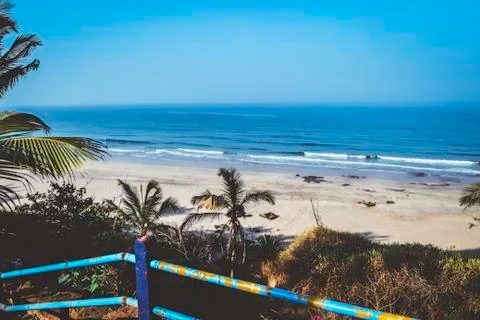 Panorama  landscape  view  of  a  beautiful  tropical  sea  beach  in  summertime  during  christmas  holiday.  (  MUMBAI,  MAHARASTRA,  INDIA).  Travel  vacation  and  holiday  concept. xkwx ocean,  wave,  clear-sky,  water,  background,  sand,  nature,  beauty,  outdoor,  coast,  foam,  sun,  shore,  cloud,  surf,  scenic,  relax,  blue,  sandy,  turquoise,  tranquil,  paradise,  tropic,  nobody,  sunshine,  natural,  horizon,  sunlight,  splash,  south,  exotic-bay,  amazing,  italy,  seaside,  portugal,  coconut,  idyllic-place,  lagoon,  coastline,  relaxation,  wonderful,  seashore,  scenery-calm,  sea-beach,  coastal,  tropical,  marine,  aqua,  wavy,  shoreline