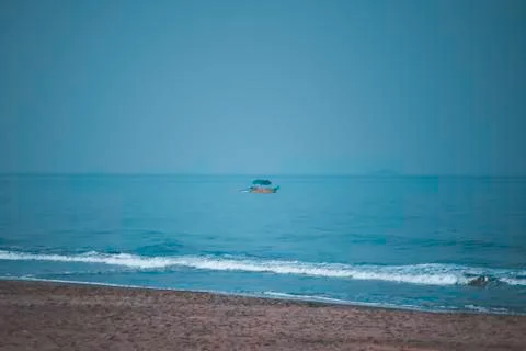 Panorama  landscape  view  of  a  beautiful  tropical  sea  beach  in  summertime  during  christmas  holiday.  (  MUMBAI,  MAHARASTRA,  INDIA).  Travel  vacation  and  holiday  concept. xkwx ocean,  wave,  clear-sky,  water,  background,  sand,  nature,  beauty,  outdoor,  coast,  foam,  sun,  shore,  cloud,  surf,  scenic,  relax,  blue,  sandy,  turquoise,  tranquil,  paradise,  tropic,  nobody,  sunshine,  natural,  horizon,  sunlight,  splash,  south,  exotic-bay,  amazing,  italy,  seaside,  portugal,  coconut,  idyllic-place,  lagoon,  coastline,  relaxation,  wonderful,  seashore,  scenery-calm,  sea-beach,  coastal,  tropical,  marine,  aqua,  wavy,  shoreline
