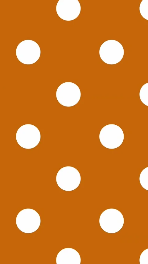 094_Polka dot pattern on orange background.mp4 Stock Footage 348100549