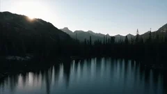 4K Epic Aerial shot of Mountain Alpine Idaho Lake with mountains and forest p