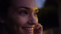 Closeup Portrait Of Happy Young Woman, Her Face Is Beautifully Lit By City Light