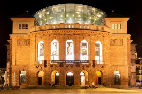 Mainz, Germany, Gutenbergplatz, October 12th. 2018 - Staatstheater Mainz at night. The theatre was build between 1829 and 1833 by the architect Georg Moller and unifies music theatre, theatrical performance and dance. xkwx mainz, germany, theatre, theater, staatstheater, urban, scene, old, architecture, night, evening, nightlife, dusk, people, city, culture, europe, square, street, pedestrian, art, travel, red, ancient, market, european, tourist, town, german, gutenberg, rhineland-palatinate, beautiful, glass, national, beauty, walking, facade, summer, symbol, vintage, retro, view, building, moller, georg, 1833, Mollerbau, Gutenbergplatz