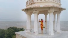 An Aerial shot of a Bharatanatyam Indian dancer performing in traditional sari