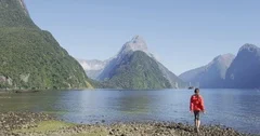 New Zealand Tourist hiking in Milford Sound by Mitre Peak in Fiordland