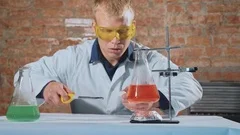A scientist conducts an experiment and his hand lights up