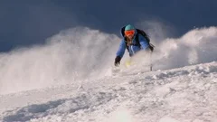 Expert female skis down deep powder snow, Alta, Utah.