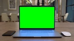 Computer laptop with green screen.