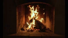 A looping clip of a fireplace with medium size flames. Burning Fire In The