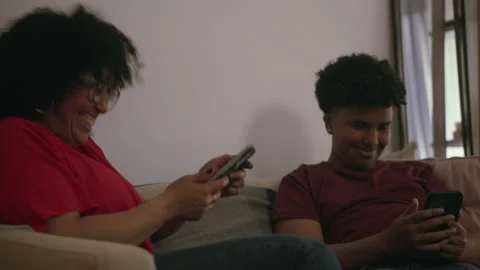 0Z MomAndSonSharingMemes Stock Footage 236251334