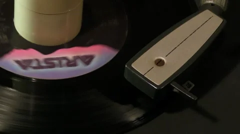 1-1985s 45 single record spinning around on 1960s turntable v2 Stock Footage 7727508
