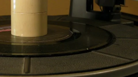 1-1985s 45 single record spinning around on 1960s turntable v1 Stock Footage 7730517