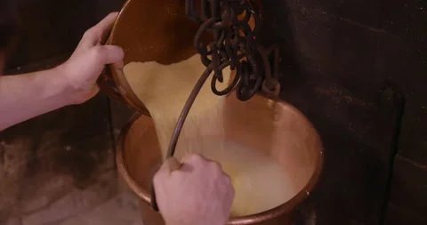 1 Cook Pouring Corn Flour Cooking Polenta Cornmeal In Italy Stock Footage 132258845