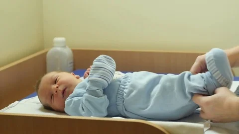 1 day old newborn on the table in hospital with mama Stock Footage 71541356