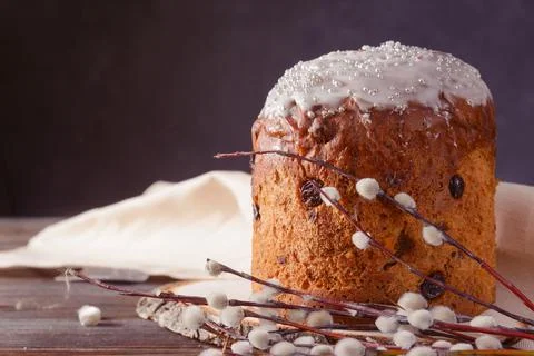 1 easter cake with  willow twigs, light napkin on dark background Stock Photos