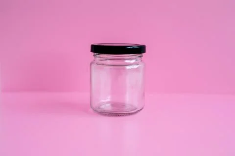 1 empty jar, black lid, with a pink scene Stock Photos