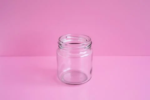 1 empty jar, no lid, with a pink scene Stock Photos