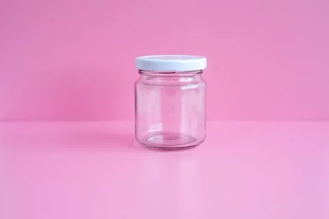 1 empty jar, white lid, with a pink scene Stock Photos