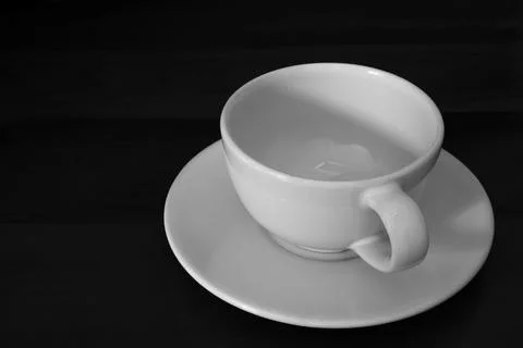 1 empty white tea cup background on black background. Stock Photos