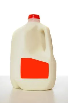 1 gallon of milk in a milk carton on a shiny table with white background. Stock Photos
