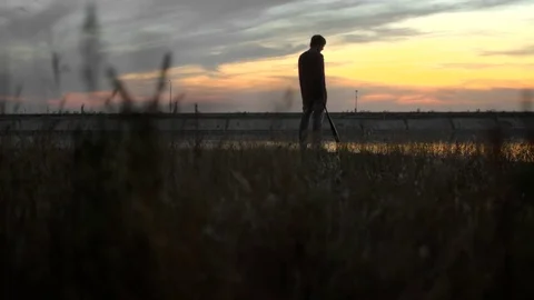 1 guy with bat in hand go. Man hit through air 4k. Maniac carries stick in hand. Stock Footage 72637680